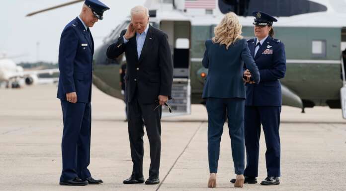 ‘Watch out for the cicadas’: Biden takes a hit to the neck as he departs for foreign trip