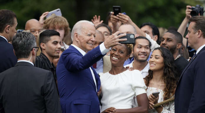 Biden ties battle against Covid to American traditions