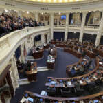 Idaho advances bill easing worker compensation for vaccine side effects, other COVID-related bills