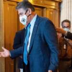 Manchin issues warning about rising inflation, as clock ticks on social spending bill