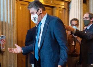 Manchin issues warning about rising inflation, as clock ticks on social spending bill