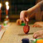 Hanukkah celebrations shine a light after a year of adversity