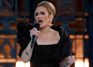 Tearful Adele announces postponement of Vegas residency day before premiere
