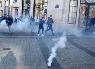 Paris Police Fire Tear Gas To Disperse Anti-Vax Mandate Protesters
